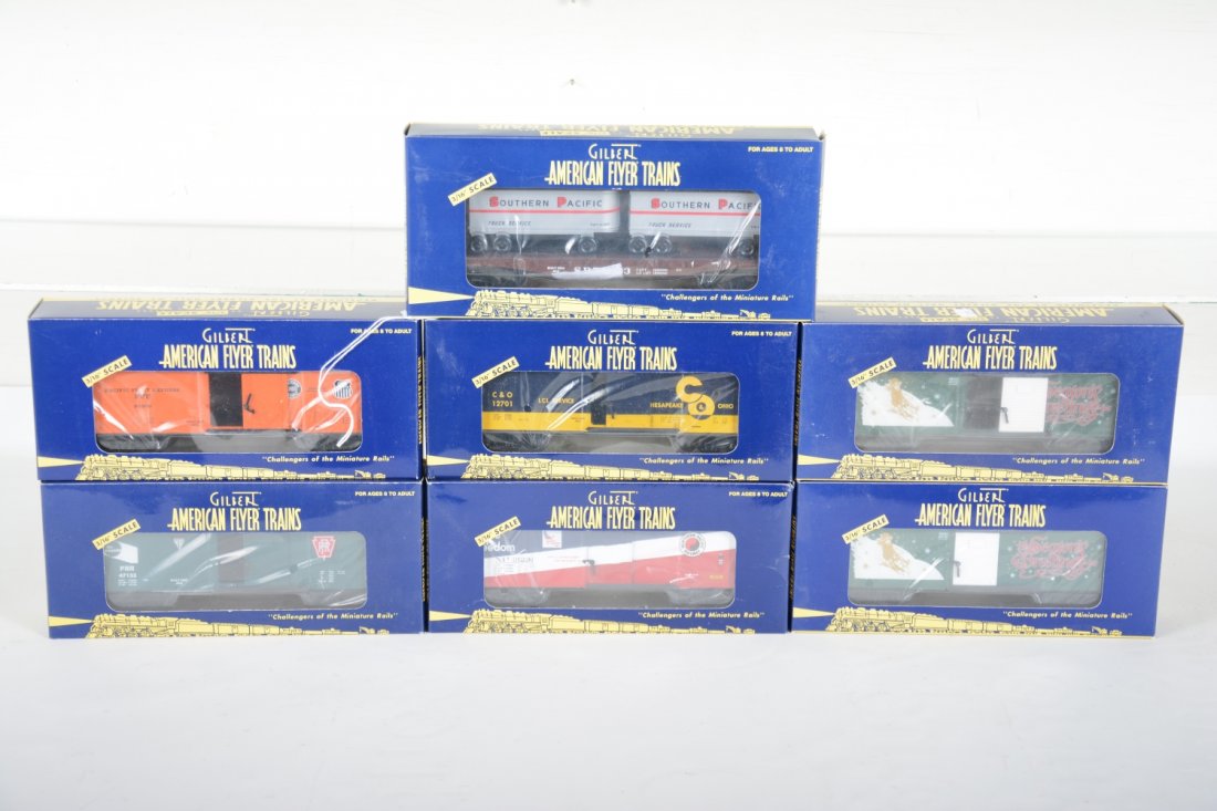 American Flyer Lionel Freight Cars: S Gauge. Includes 488087 PFE reefer; 48532 SP trailer flat; 2 #48342 2001 Christmas boxcars; 48348 NP boxcar; 48347 C&O boxcar; 48352 PRR boxcar. All appear new in boxes, C9-10