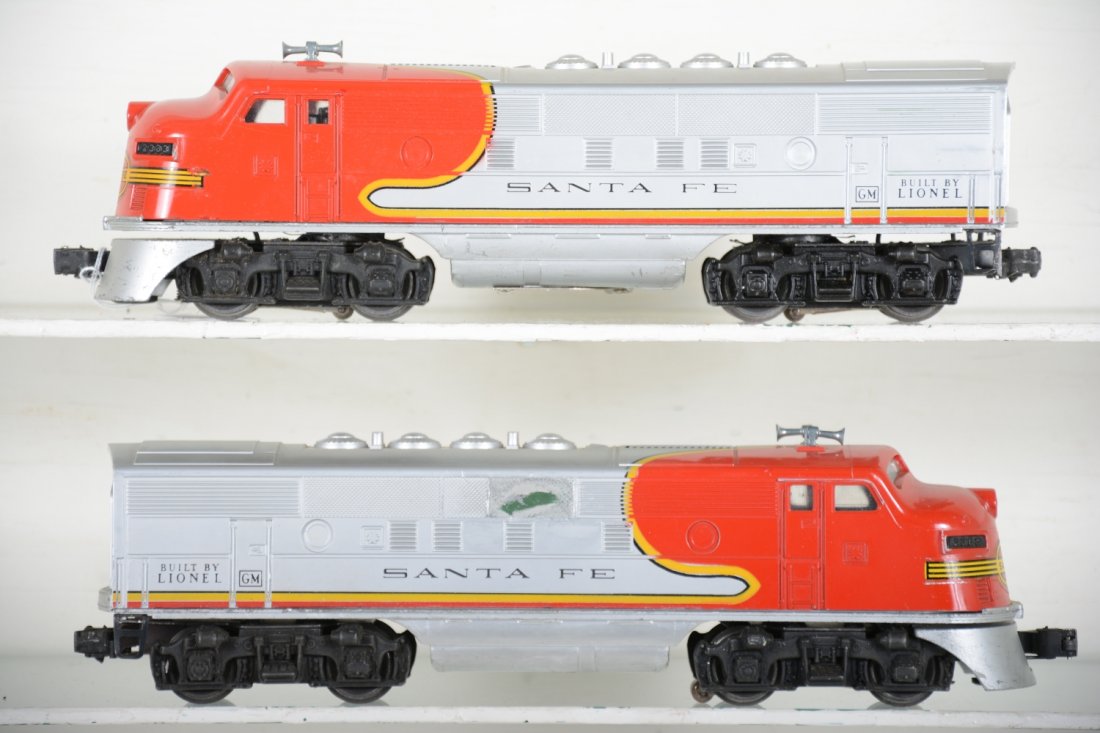 Clean Lionel 2383 SF F3 AA Diesels: Very clean shells with super decals. One unit has a disturbance on 1 side vent like a glue mark.. Battery box is clean, power unit is C7+