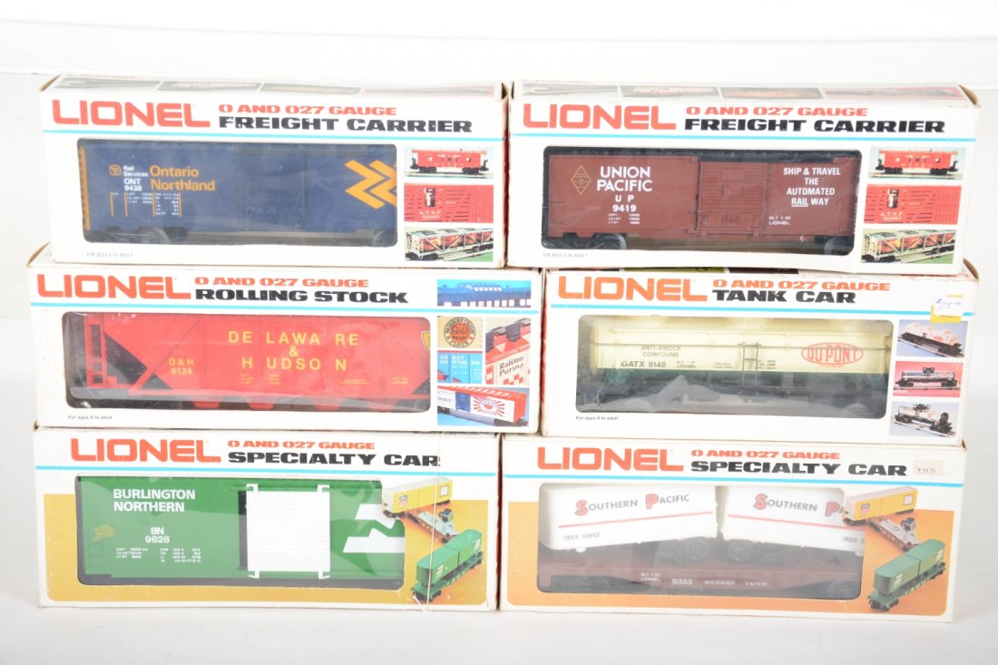 Lionel Freight Cars: Includes 9333 SP piggy-back flat; 9438 ON boxcar; 6124 D&H hopper; 9419 UP boxcar; 9628 Burlington Hi-Cube; 9148 DuPont tank car. All show very light runtime all have C9 bodies with boxes.