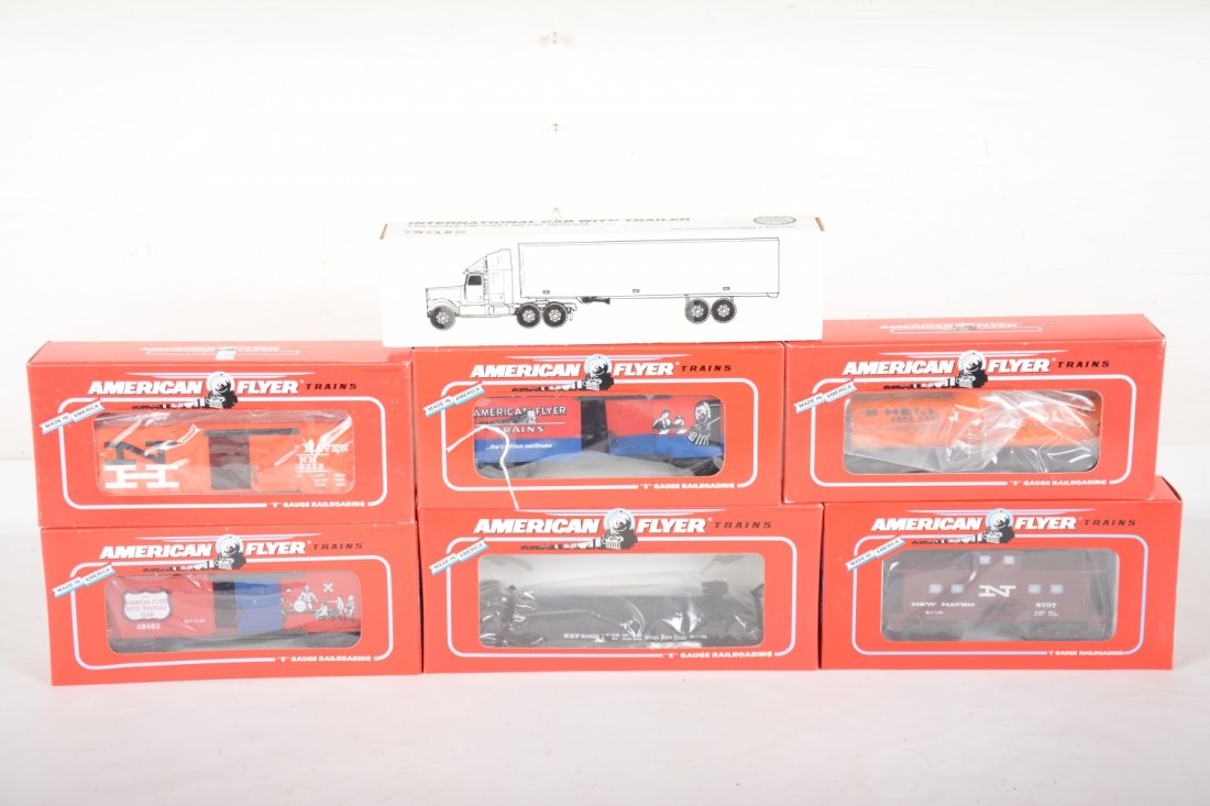 American Flyer Lionel Freight Cars: S Gauge. Includes a 48479 NASG flat with Ertl truck; 48322 NH boxcar; 48700 NH caboose; 48483 & 48484 AF RRC boxcars; 48405 Shell tank. All are new in boxes, C10