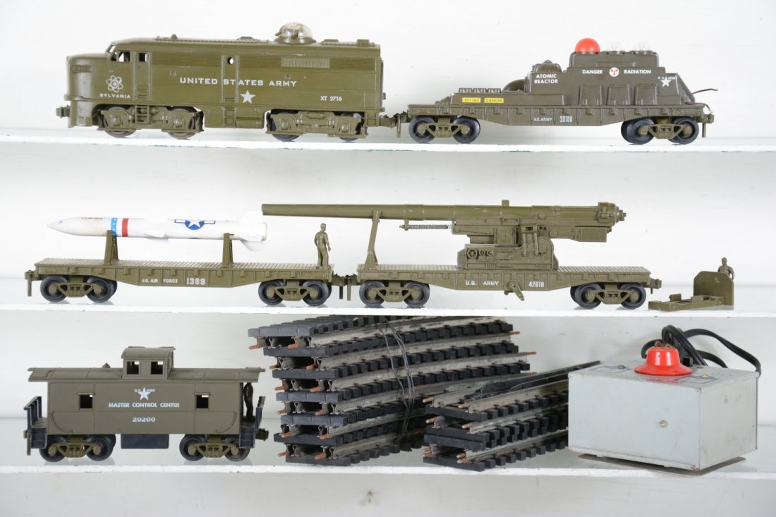 Kusan Atomic Set: 2-rail DC; Includes a US Army Alco diesel, missing ornamental horn, gun turret intact; missile carrier; Big Bertha cannon car; Atomic Energy car, missing clips; Control Center caboose, missing dish an