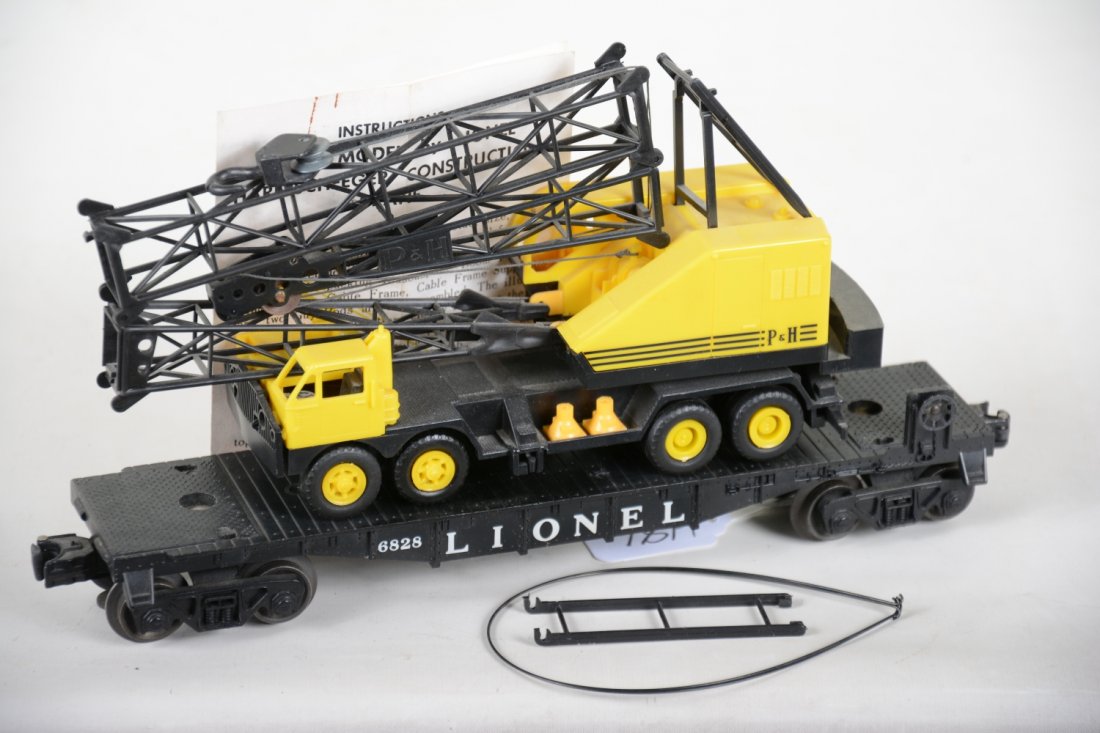 Lionel 6828 Flat with P&H Crane: Nice example, complete with just a small hairline on one top support strut. It has its cones and instructions and show light playwear, otherwise C8