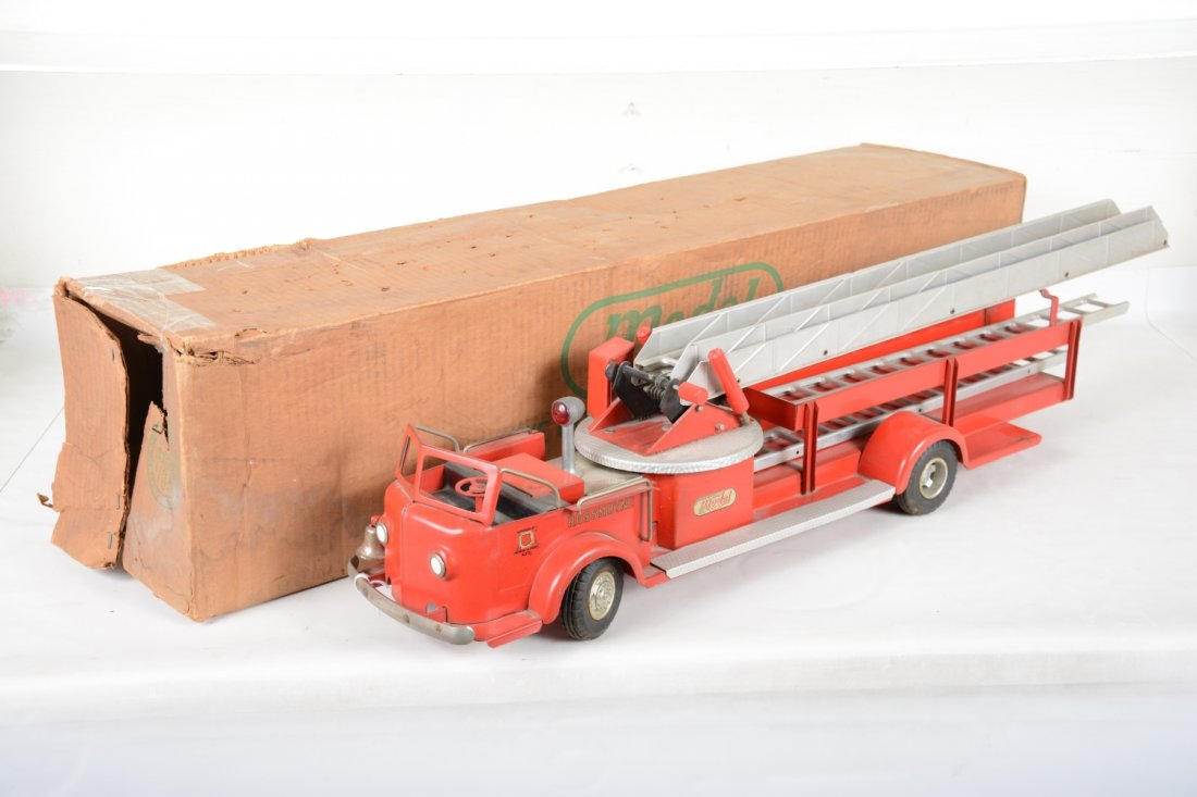 Boxed Doepke 2008 Aerial Ladder Truck: Clean original owner piece! Painted pressed steel with rubber tires and nickel accessories. All mechanisms function including the clockwork siren. It has its extra ladders and a worn original box. It 