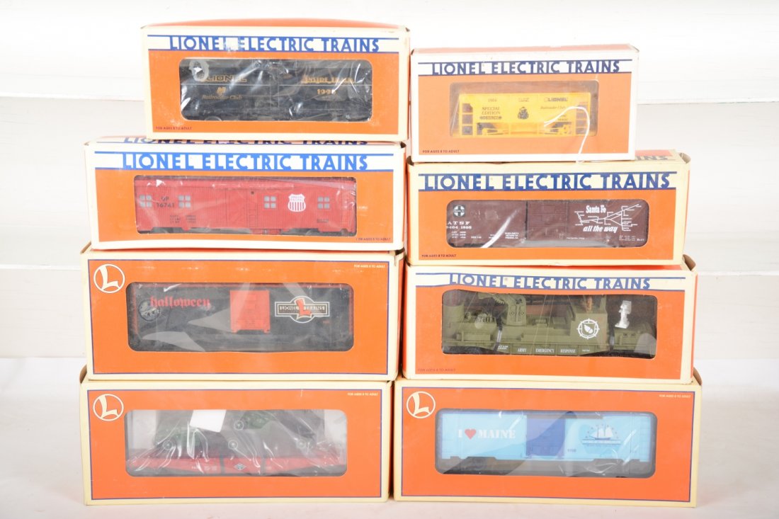 Lionel Freight Cars: Includes 29231 animated Halloween car; 16726 Army fire ladder car; 17534 Diamond T flat with Macks; 52058 SF boxcar; 19968 Maine boxcar; 16800 LRRC ore car; 16741 UP bunk car; 19935 LRRC tank. Most ap