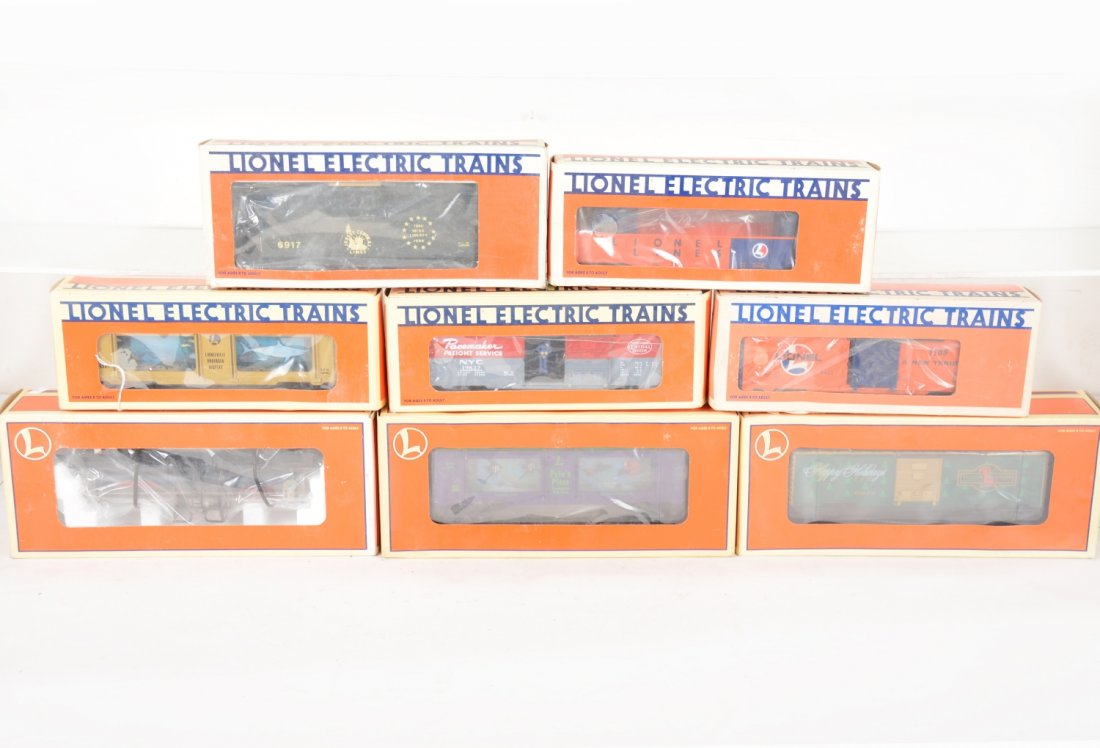 Lionel Freight Cars: Includes 16681 aquarium car; 19827 NYC operating boxcar; 9492 LL boxcar; 16160 Atomic tank car; 6917 JC caboose; 6214 LL gondola; 16291 Christmas boxcar; 19965 LRRC aquarium car. All appear like new w