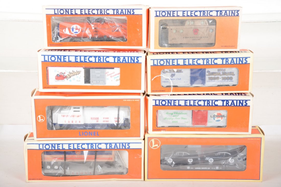 Lionel Freight Cars: Includes 19924 LRRC boxcar; 19908 Christmas boxcar; 6313 LL tank; 16924 Trailer flat; 17557 Rt 66 flat with sedans; 19702 PRR MINT Caboose; 19824 target launcher; 9491 Christmas boxcar. All appear new