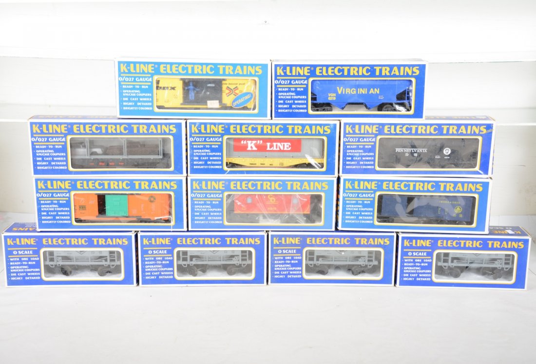 K-Line Freight Cars: Includes 7008 operating boxcar; 6221 boxcar; 6611 container flat; 6410 boxcar; 612102 caboose; 4 #6710 ore cars. All appear new in boxes, C9-10