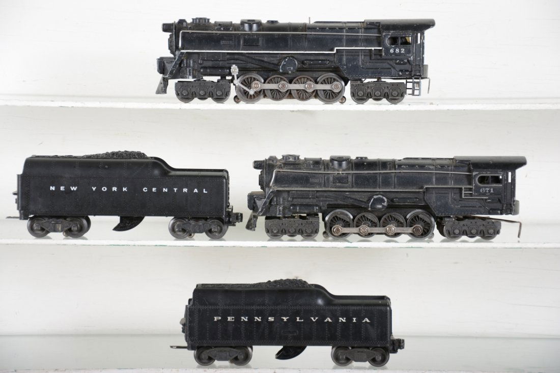 2 Lionel Turbines: Includes a 671(RR), missing rear steps; 2046W-50 tender with cracked shell; 682 turbine, stripe touched-up with 2046W tender with 773W shell, large screw crack. Over-all C6 ish