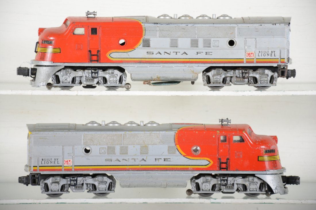 Lionel 2343 SF F3 AA Diesels: Dual motor power unit has light battery corrosion on box edge & metal cover, inside clean; matching 2343T non powered unit has some mildew the may clean. Both are missing port hole lenses and show mod