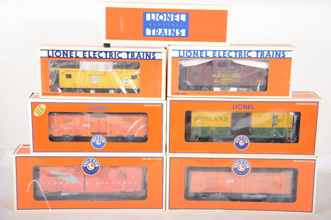 Lionel Deluxe Freight Cars: Includes 9225 TMCC operating barrel car; 29811 MDT reefer with smoke, light & Sounds; 52483 Rutland boxcar; 19807 PRR Smoke Caboose; 19715 DM&IR caboose; 17338 MDT reefer; 17278 WP boxcar. All appear 