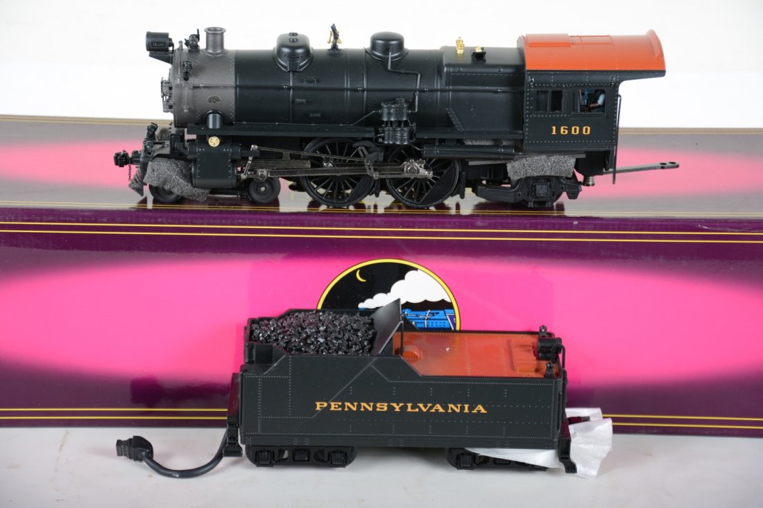 MTH Premier 20-3038-1 PRR Atlantic Locomotive: 042. Nice dual flywheel drive loco with ProtoCouplers, ProtoSounds 2.0 with squeaking brakes and Freight yard ProtoEffects. It has been lightly run with C9 body with box.