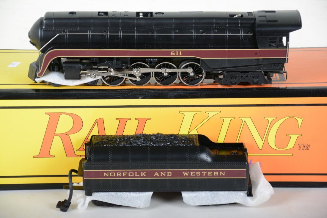 MTH RailKing 1105 N&W J Steam Locomotive: Nice diecast loco & tender with smoke, light & electronic whistle. It show light runtime with C9 bodies with setbox.