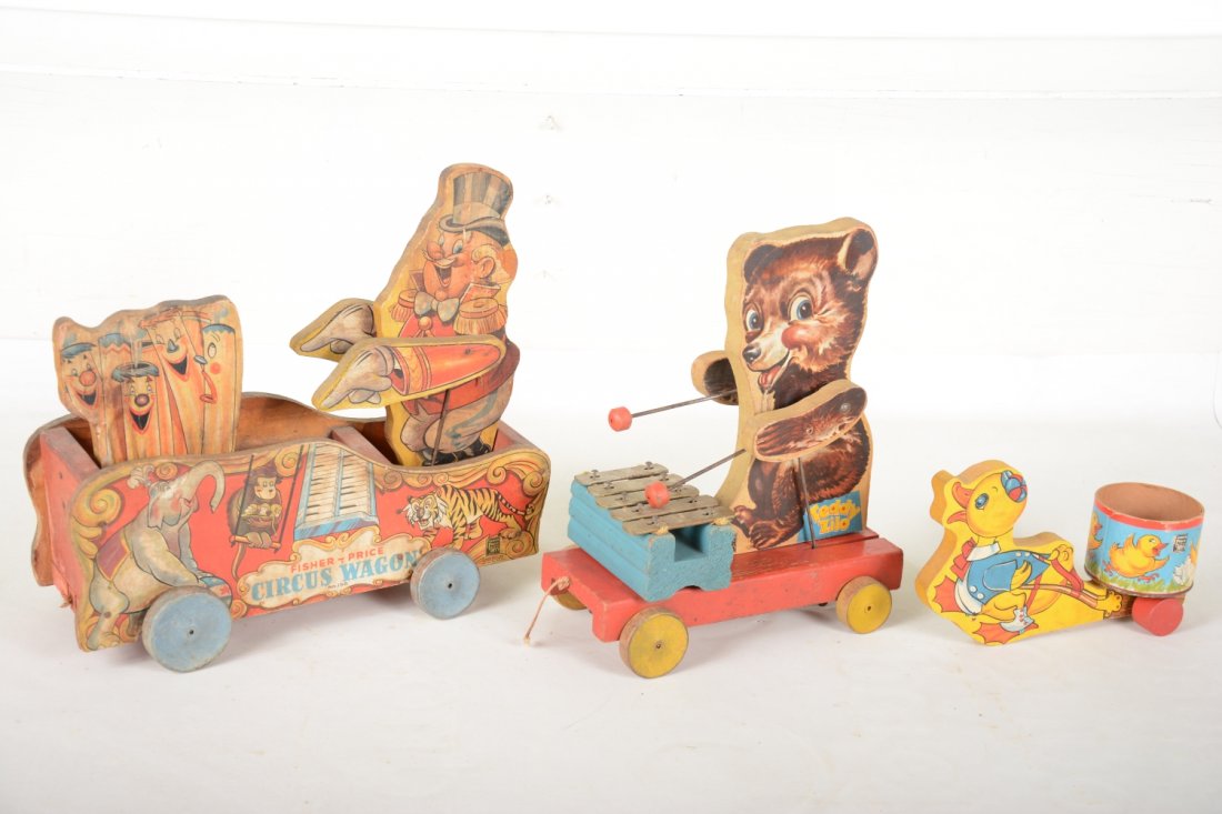 3 Early Fischer Price Toys: Includes black label 156 Circus Wagon with coliapee, C6; black label 752 Teddy Zilo, C7; black label 16 Chicky cart, C8.
