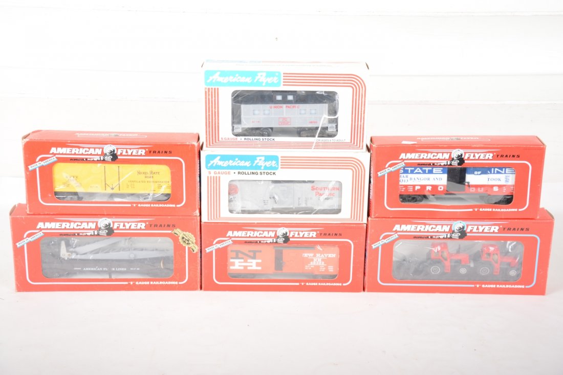 Lionel American Flyer Freight Cars: Includes 48509 flat with tractors, C8; 48322 NH boxcar; 48313 B&A boxcar; 48703 UP caboose; 9711 SP boxcar; 48807 NPR reefer; 49009 flat with derrick, C8. Rest appear new in boxes, C10