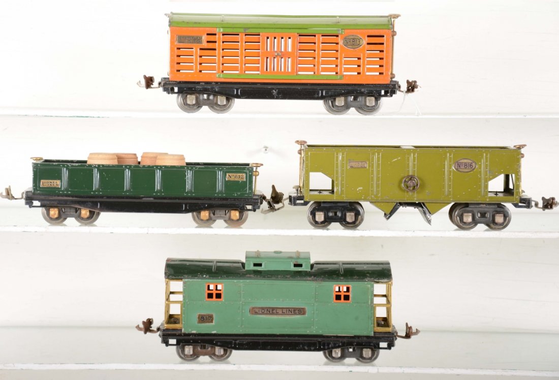 Clean Lionel 600 Series Tinplate Freight Cars: Includes 816 olive hopper; 812 gondola with 3 spilt barrels; 813 stock car; 817 caboose, all 1930 nickel journals. They show moderate playwear, C6