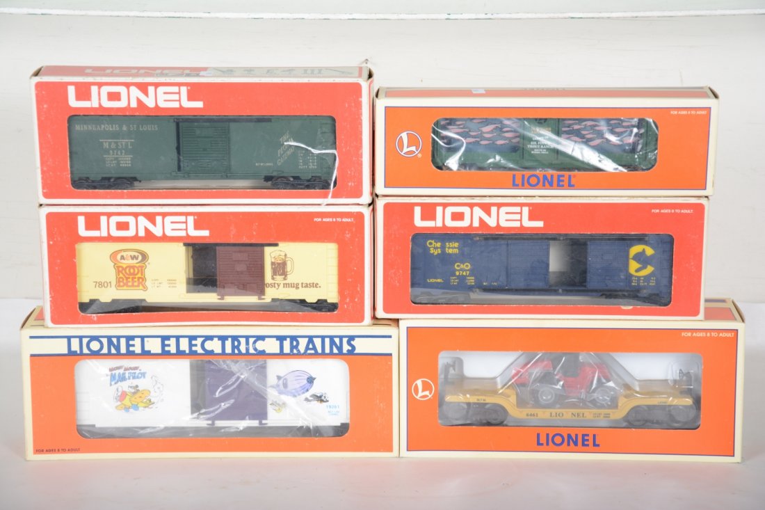 Lionel Freight Cars: Includes 19261 Perils of Mickey Mouse boxcar; flat with tractor; 16742 aquarium car; 9742 M&StL boxcar; 9747 Chessie boxcar; 7801 A&W boxcar, some show light runtime, all with C9 bodies with boxes.