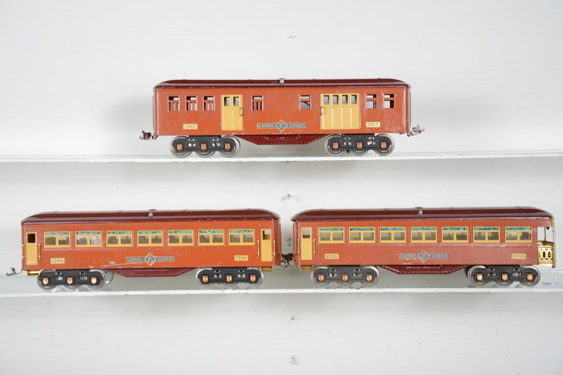 Lionel 1700 Passenger Cars: Standard gauge. Includes a 1767 baggage; 1766 coach & 1768 observation, missing drumhead insert. They make a handsome set with the 385E in the previous lot. They show light to moderate playwear, C7-
