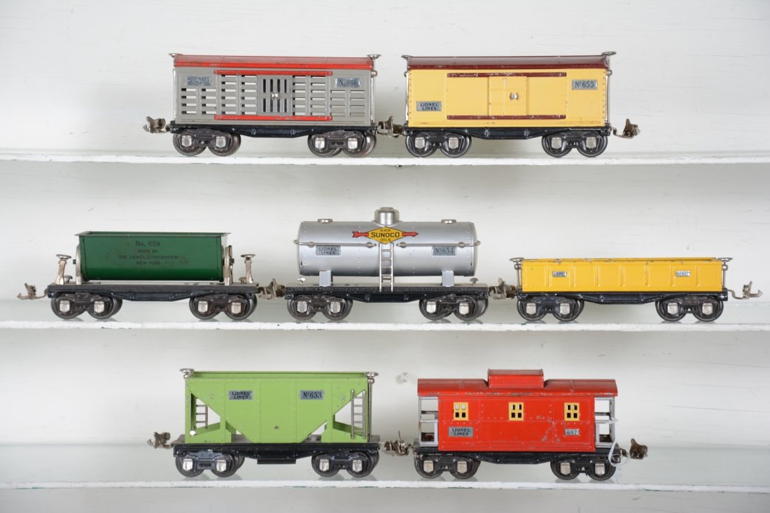 Lionel 600 Series Freight Cars: All are clean & shiny including a 652 gondola; 653 hopper; 654 Sunoco tank car; 655 boxcar; 656 stock car; 659 tipple car; 657 caboose. All show moderate playwear, C6