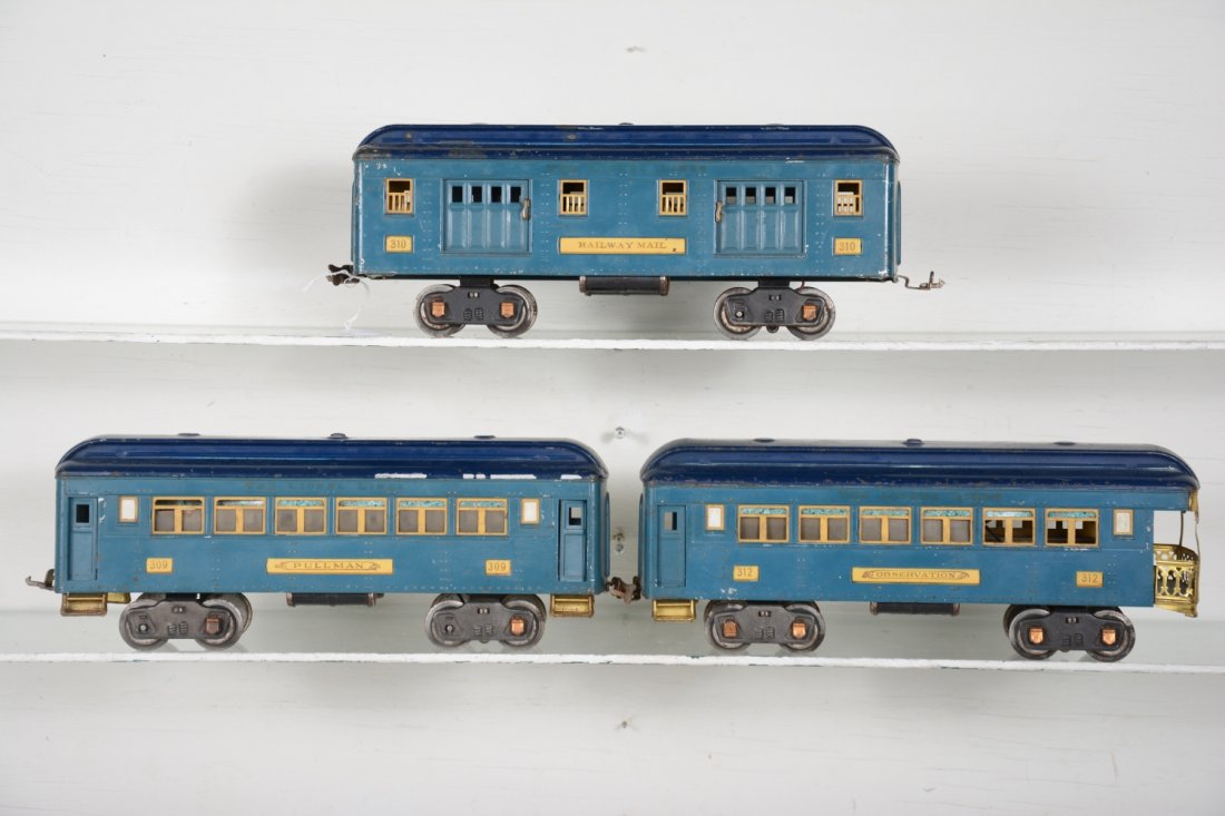 Lionel 310 Series Passenger Cars, T-Tone Blue: Standard Gauge. Just need a black 1835E to make the set, circa 1933. Includes 310 baggage; 309 Pullman; 312 observation. They have nice lettering and would benefit from a cleaning. They are missing 6 