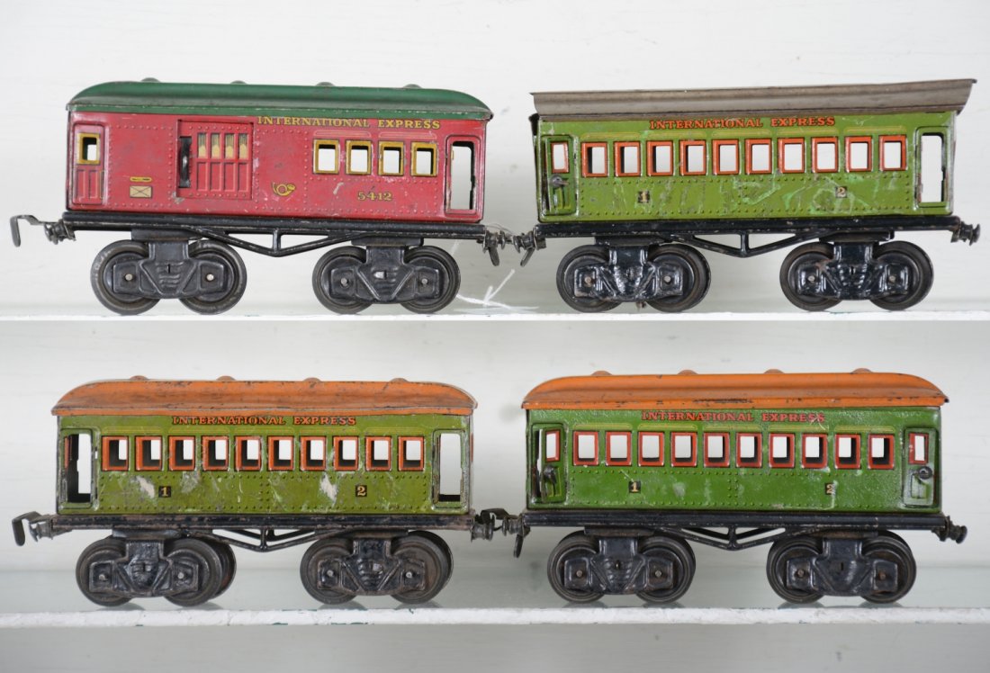 4 Fandor Passenger Cars: Includes a 5412 International Express combine; 3 matching coaches, 1 with incorrect roof, only 4 doors present. They are fairly clean and show moderate playwear, otherwise C6 ish