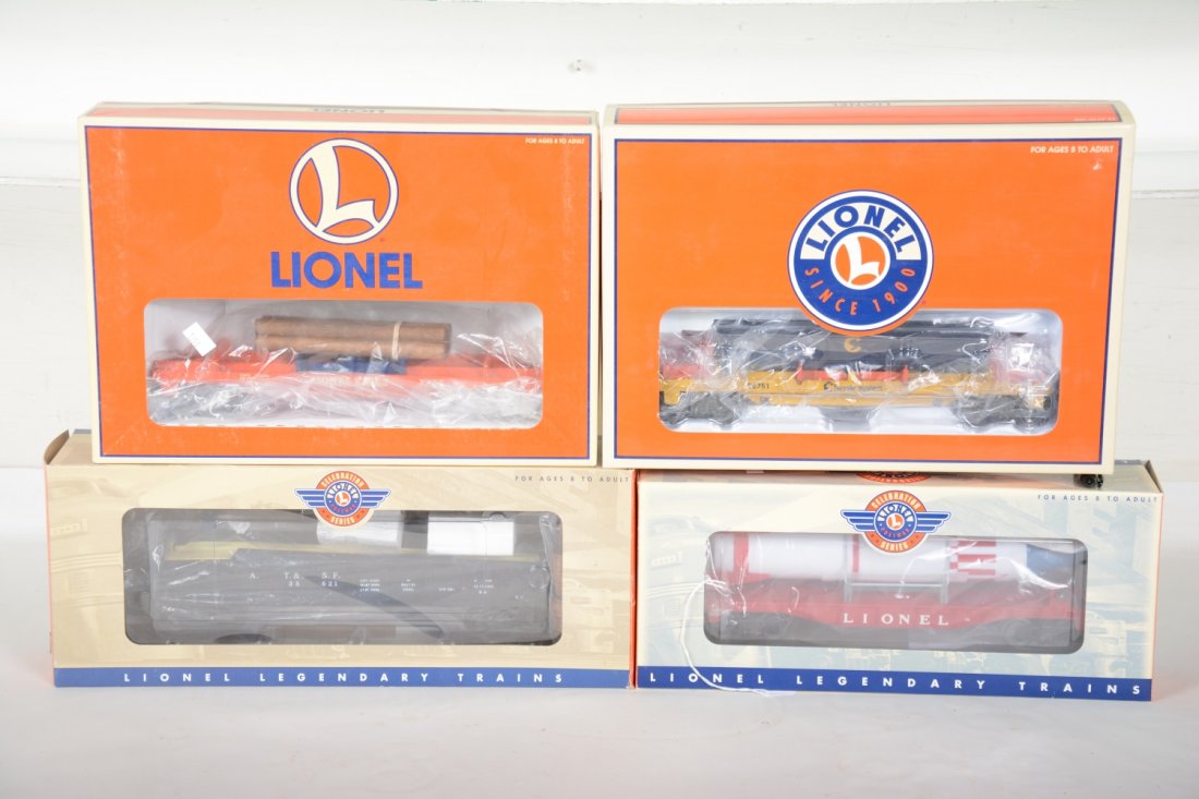 Lionel Freight Cars: Includes Celebration 26025 rocket flat; & 26757 barrel car; 26751 Chessie ore dump car; 26772 Lionel log dump car. They show very light use with boxes, C8+-9