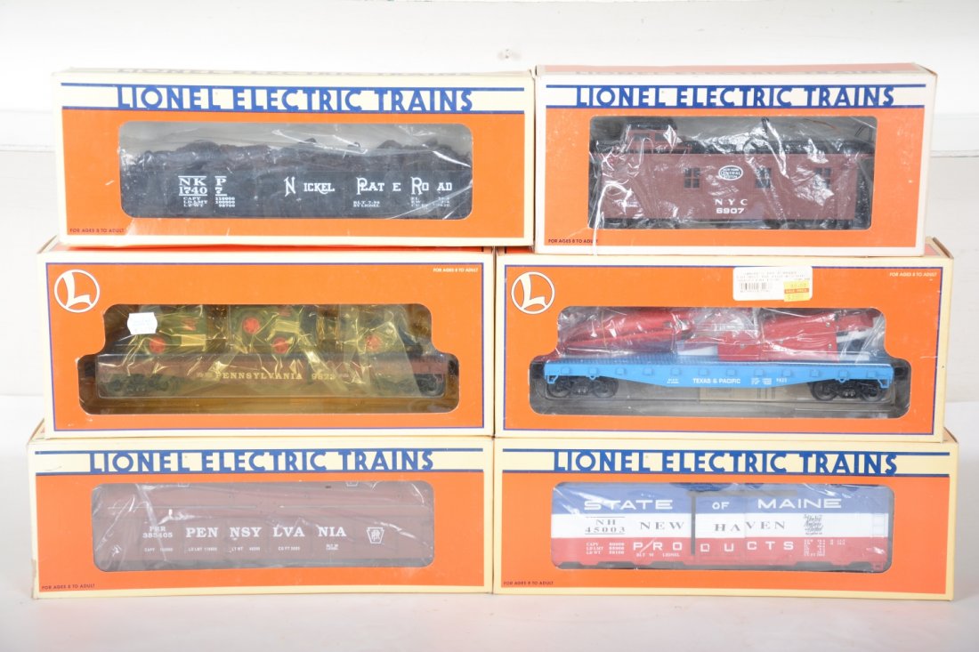 Lionel Freight Cars: Includes 6907 NYC caboose; 17407 NPR gondola; 17516 T&P airplane flat; 17406 PRR coil car; 17217 SOM NH Boxcar; 17518 flat with Mac trucks. Most appear like new with boxes, C9+-10