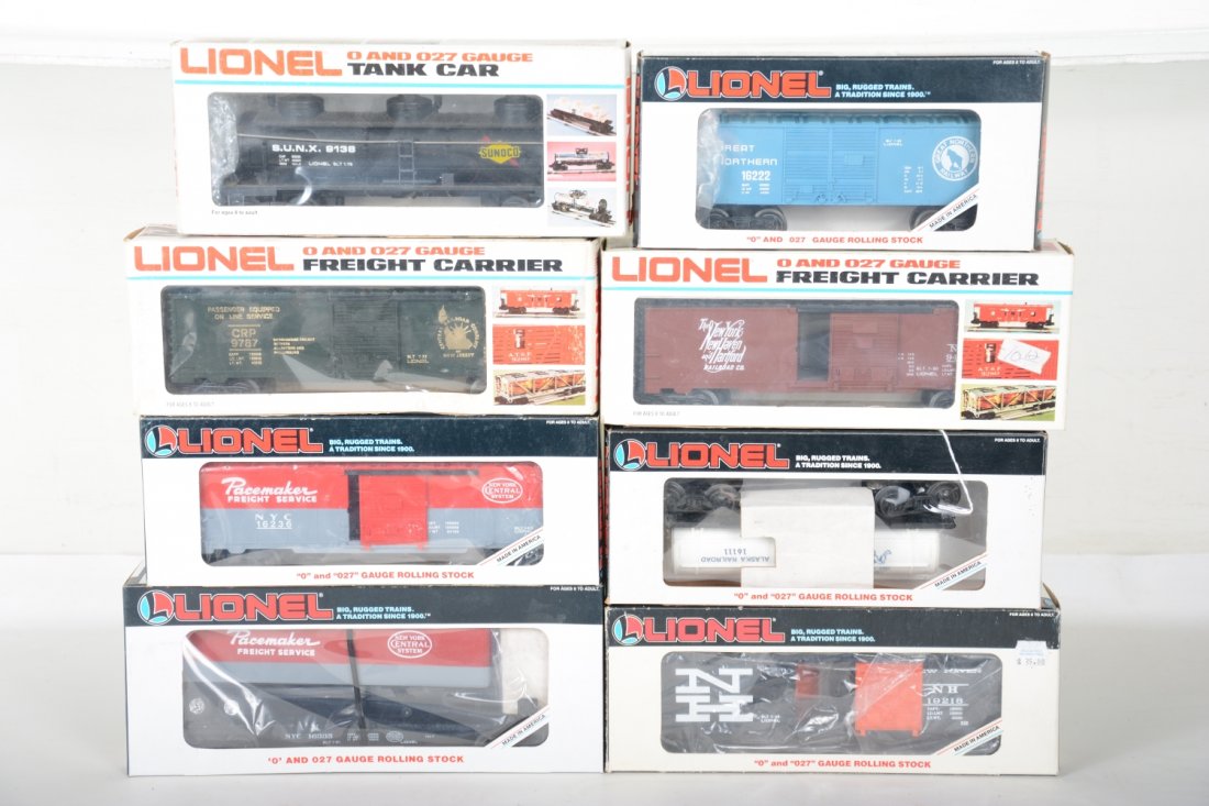 Lionel Freight Cars: Includes 16111 Alaska tank car; 16335 NYC trailer flat; 9787 JC boxcar; 9423 NYNH&H boxcar; 16222 GN boxcar; 9138 Sunoco tank; 19218 NH boxcar; 16236 NYC boxcar. All show light runtime with C9 bodies 