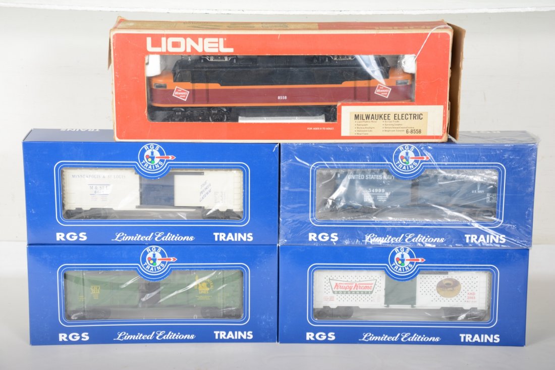 Lionel & RGS Freight Set: Includes a Lionel 8558 MR EP5 electric, showing light runtime with C9 body with incomplete box; RGS M&StL boxcar; Krispy Cream boxcar; JC boxcar; US Navy boxcar, cars appear like new in boxes, C9-10