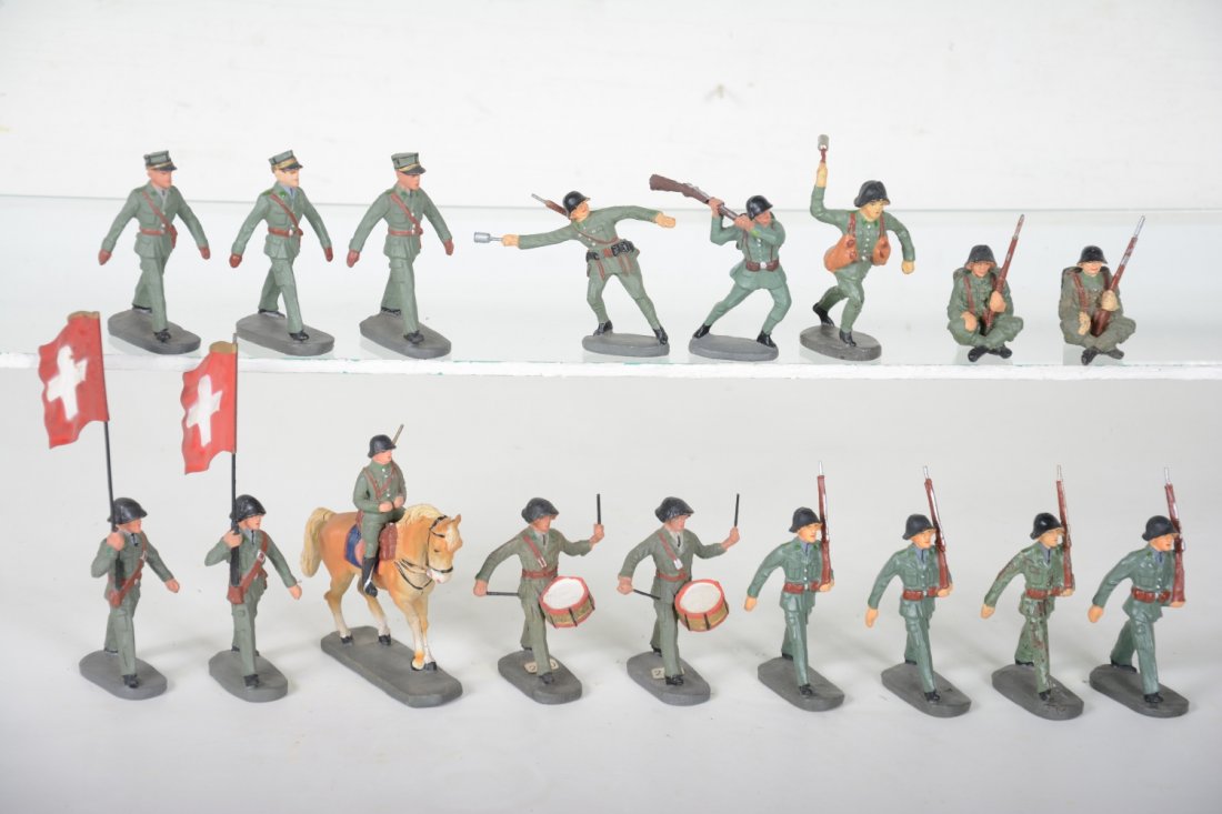 Unusual Elastolin Swiss Army Soldiers: Includes 2 flag bearers; mounted; 4 marching, 1 is C6; 2 side drummers; 3 officers; 2 grenade throwers; 2 at rest; 1 rifle striking. Rest are clean and 95% or better, intact, showing light playwear, C