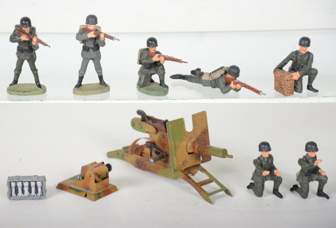 Elastolin German Soldiers & Large Machinegun: Includes a 6" cap firing machine gun. Roll caps still installed and functional(loud too), light rust in mechanism; small tin mortar; open box shells & 7 figures. Rest are clean and 95% or better, inta