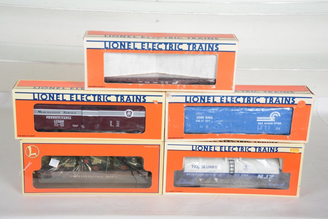 O Ga. 5 Lionel Standard O Freight Cars: Includes 17301 Conrail reefer; 17902 NJ Zinc tank car; 17501 Conrail stake flat; 17220 PRR merchandise car; 17519 flat with Corgi Macks. Some show light runtime C9-10