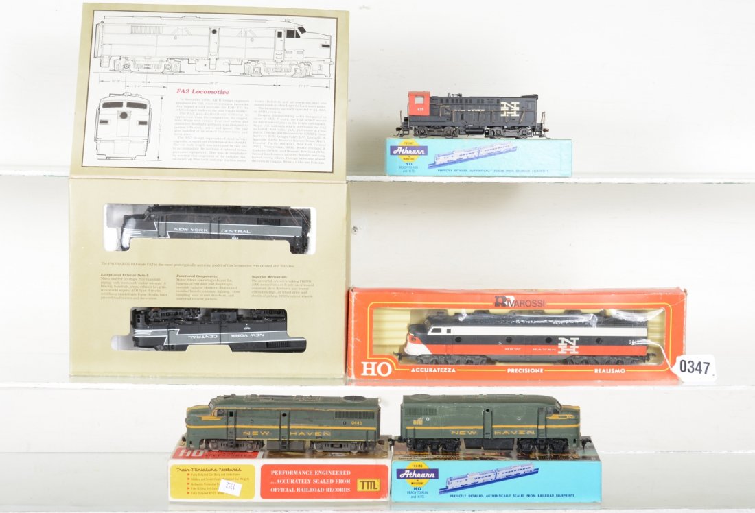 Boxed HO New Haven Diesels: Includes a Proto 2000 FA2 AA with 1 box; RivaRossi NH E8 diesel; Custom painted Athearn & TMI NH F7 AA; Athearn NH SW1 diesel, ob incorrect. They show light to moderate playwear, C7-8+