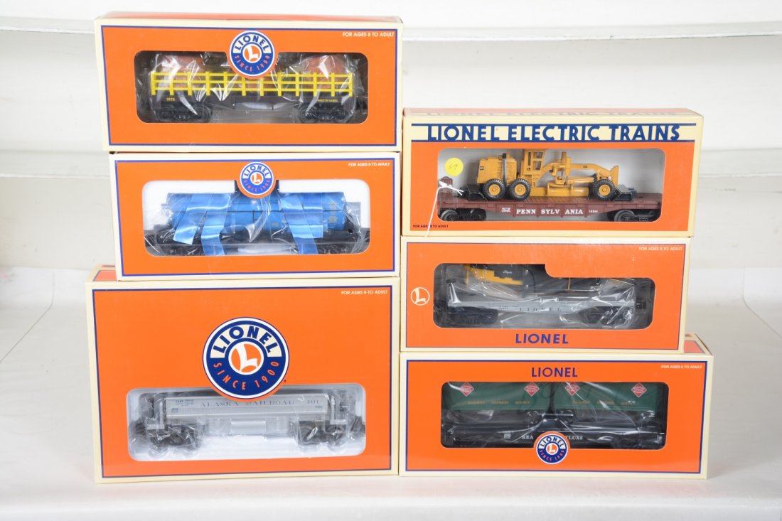 Lionel Freight Cars: Includes 36765 Alaska coal dump; 26065 REA flat with trailers; 29459 water barrel car; 19645 Penn salt tank; 19430 flat with plane; 16934 PRR flat with grader. All appear like new with boxes, C9+-10