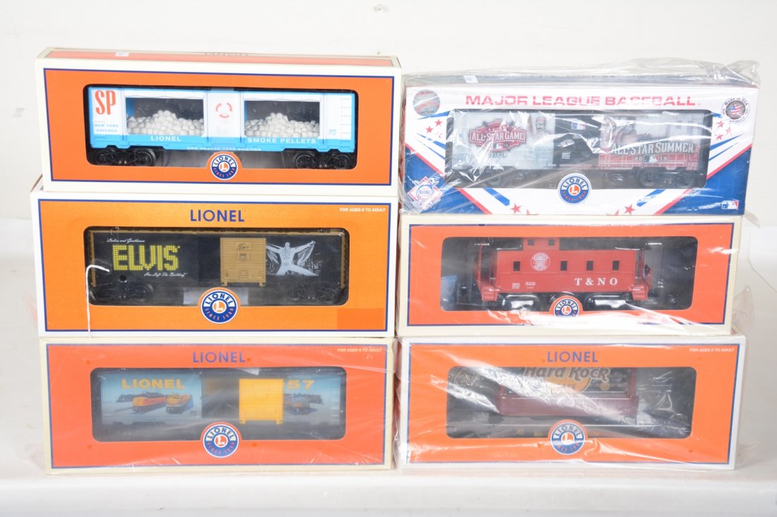6 Lionel Freight Cars: Includes 82997 All Stars boxcar; 29649 SP mint car; 29944 Lionel art boxcar; 26308 Hard Rock flat with billboards; 39262 Elvis boxcar; 36675 SP caboose. These are old store stock, C10