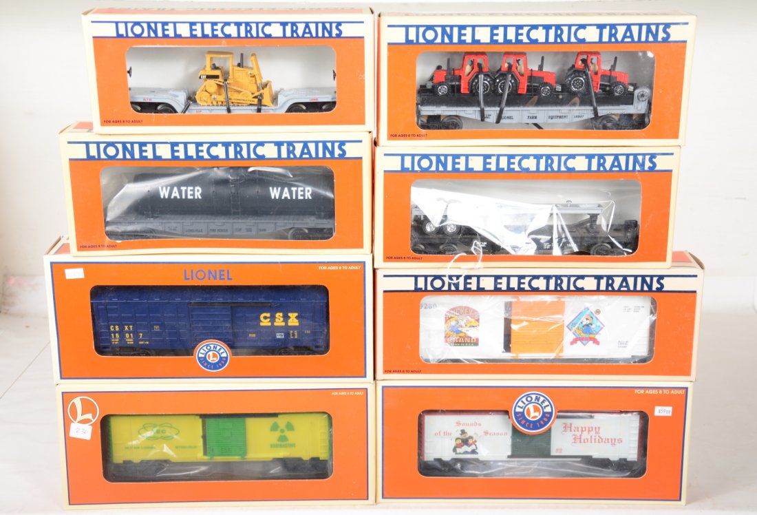 Lionel Freight Cars: Includes 15017 CSX Waffle boxcar; 28215 ACE glow boxcar; 18390 flat with tank; 19280 Mickey's Wheat hi-cube; 16907 flat with tractor; 16935 flat with dozer; 36733 Christmas music car; 16911 B&M flat w