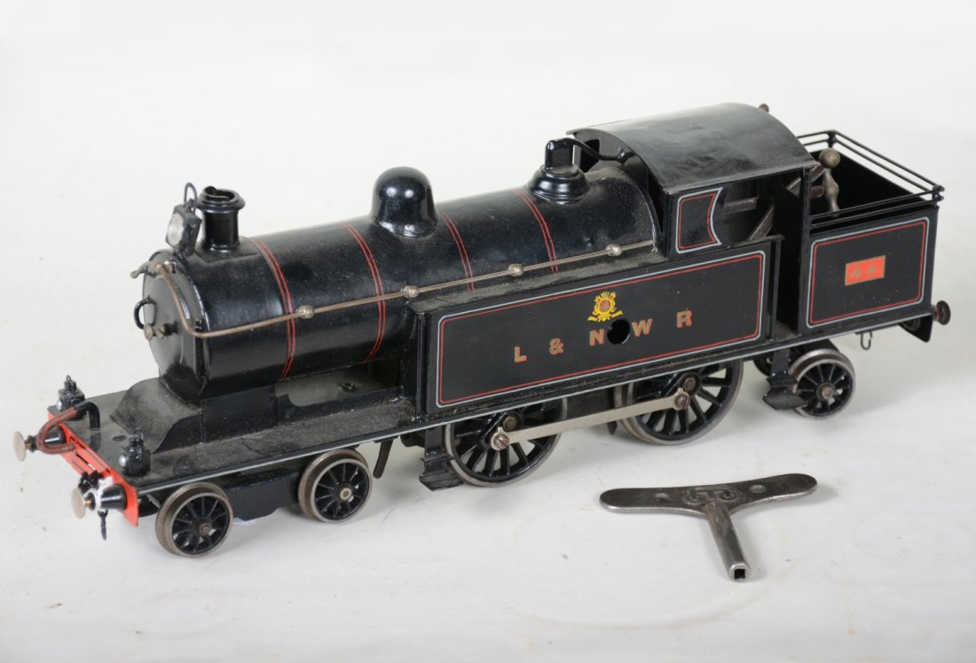 Marklin TCE1021/1 L&NWR Steam Tank Locomotive: 1 Gauge. Clean 4-6-2 loco, mechanism is functional with forward/reverse & step/start, with key. It has a restored roof with replacement headlight. Over-all shows light playwear, rest C7-7+