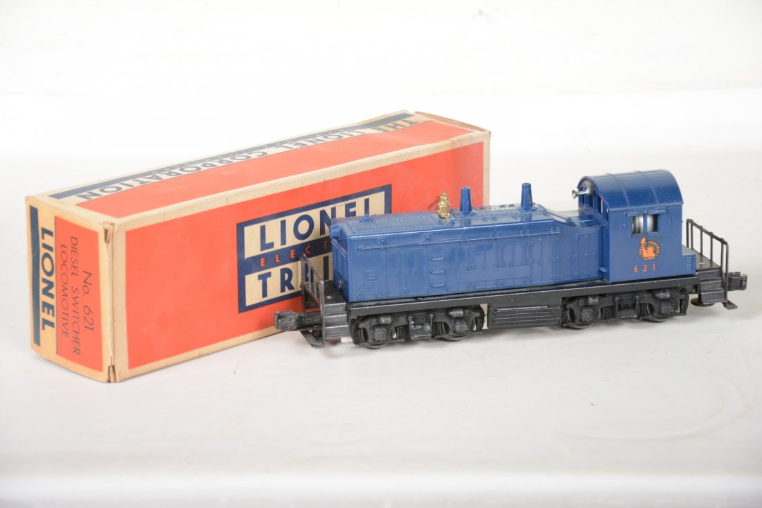 Boxed Lionel 621 JC NW2 Diesel: Clean example with minor hairline screw crack. It has clean battery box, its instructions, 1 insert and scarce box with 1 reattached flap. It shows light to moderate playwear, C7+-8. Nice!