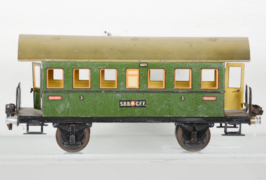 Unusual Marklin 27cm 1807/1 Swiss Coach: 1 Gauge. Clean example with opening end doors with brass handles. It shows light to moderate playwear, C7