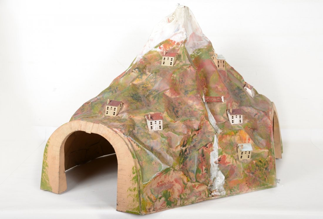 Scarce Lionel 140 Tunnel: Standard gauge. Nice original tunnel, largest metal tunnel Lionel produced. It has all its houses and would benefit from a cleaning. There is minor age cracks, but only shows light to moderate playwea