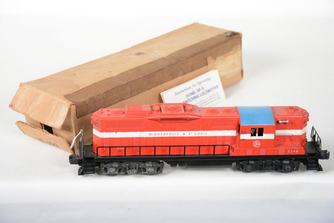 Boxed Lionel 2348 M&StL GP9 Diesel: Clean bright graphics, but has a paint flaw under stripe, one side of cab. It has a lightly run chassis with clean battery box with instructions and a soft box, otherwise appears C7+ ish