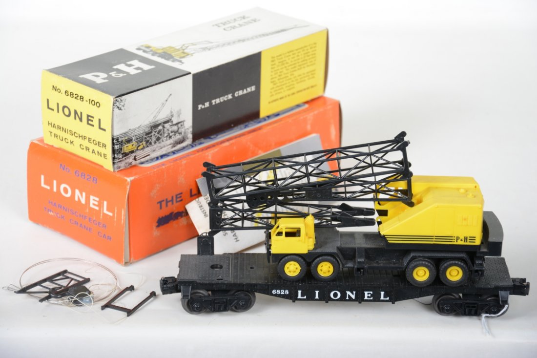 Nice Boxed Lionel 6828 P&H Crane: Nice and complete with inner box, instructions and booklet. Parts are original and intact with boom separate from body, just missing the outrigger pads. showing light handling, C8