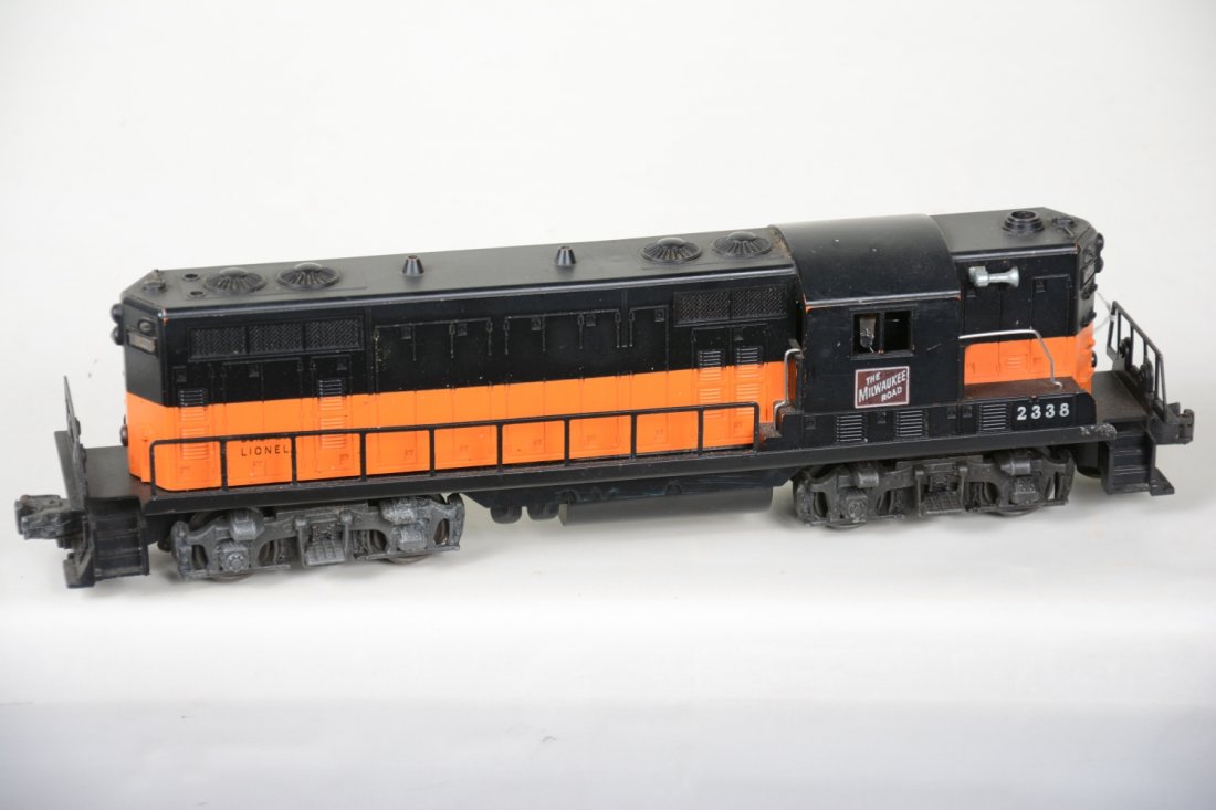 Lionel 2338 MR GP7 Diesel: Black & Orange painted on orange mold. It shows light to moderate playwear with clean battery box, C7