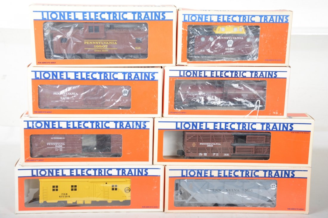 Lionel PRR Freight Cars: Includes 6307 tank car; 19807 smoke caboose; 6123 covered hopper; 5724 bunk car; 19510 stock car; 2 #9456 boxcars; 6906 caboose. All show light runtime with some in shop worn boxes, C9