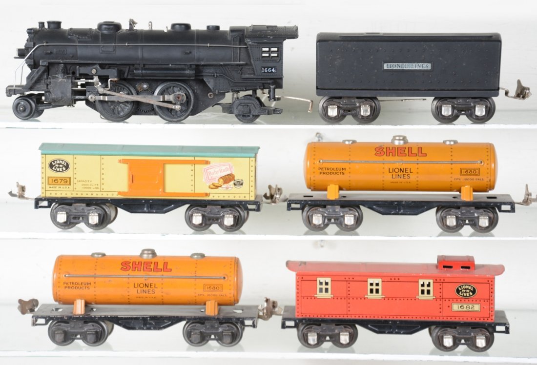 Lionel 1664 Steam Freight Set: Includes a 1664 steam loco; 1689T tender; 1679 BR boxcar; 2 #1680 Shell tank cars; 1682 caboose, roof faded. They show light to moderate playwear, otherwise, C7
