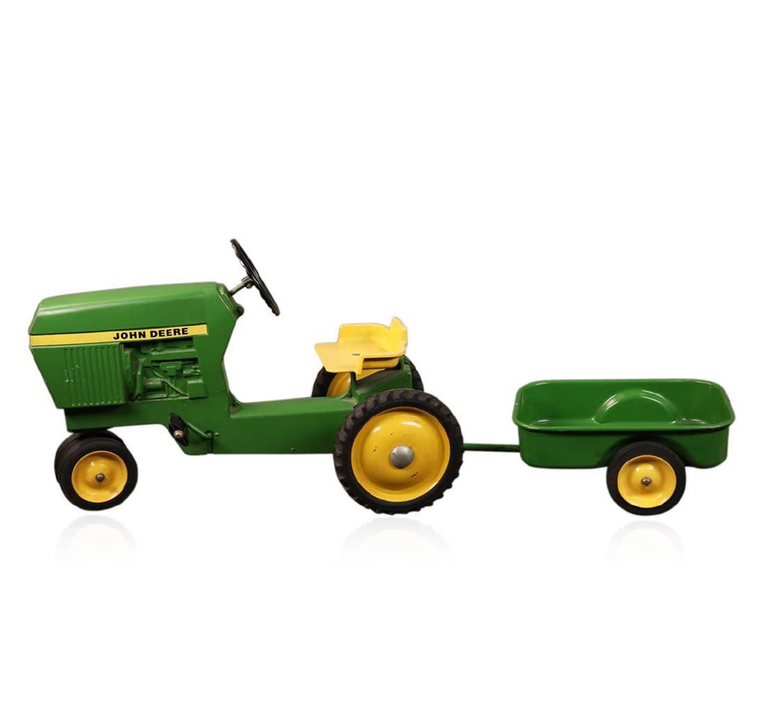 sit on toy tractor and trailer