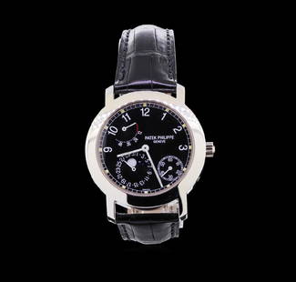 Patek Philippe Moonphase 18KT White Gold Watch: One Patek Philippe Moonphase watch, featuring: Case: round, 43mm x 38mm, 18KT white gold. Dial: black with Arabic numerals and white hands, small seconds at 4/5 o'clock and moonphase at 6/7/8 o'clock.