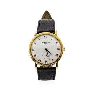 Patek Philippe 18KT Yellow Gold Calatrava Wristwatch: One Patek Philippe Calatrava manual wristwatch, case size 34mm. Patek ref. 3919 with an 18k yellow gold case and hobnail bezel, white Roman dial, sub-seconds dial, sapphire crystal, black Patek Philip