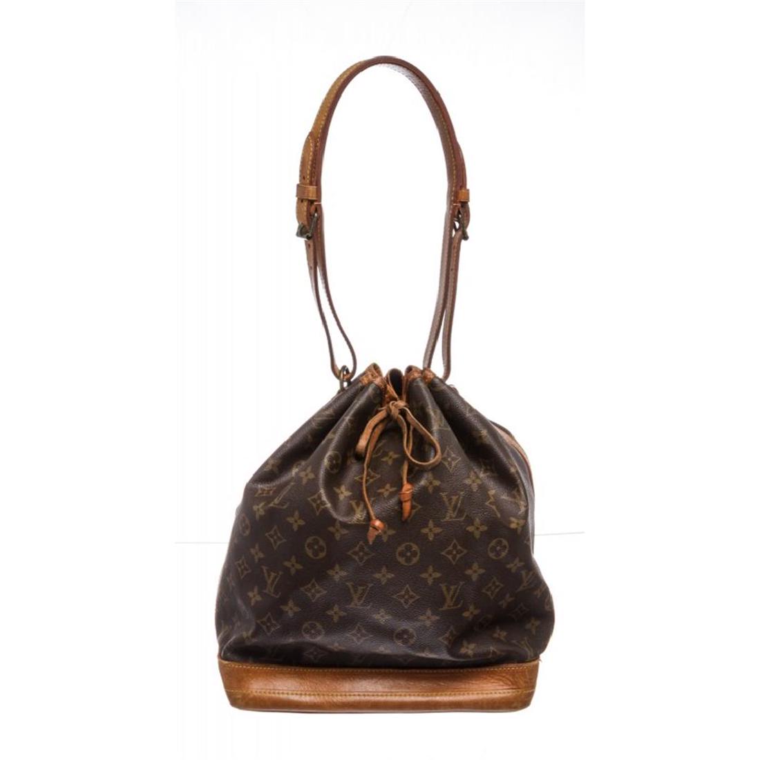 Louis Vuitton Monogram Canvas Leather Noe GM Drawstring: Brown and tan monogram coated canvas Louis Vuitton Noe GM with brass hardware, tan vachetta leather trim, single adjustable flat shoulder strap, brown canvas lining and drawstring closure at top. Item