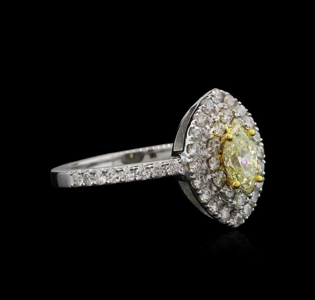 1.15 ctw Yellow Diamond Ring - 14KT White Gold: One ring featuring: 14KT white gold weighing 3.93 grams containing one prong set marquise cut fancy yellow diamond center stone with a total weight of 0.50ct and pave set round white diamonds with a t