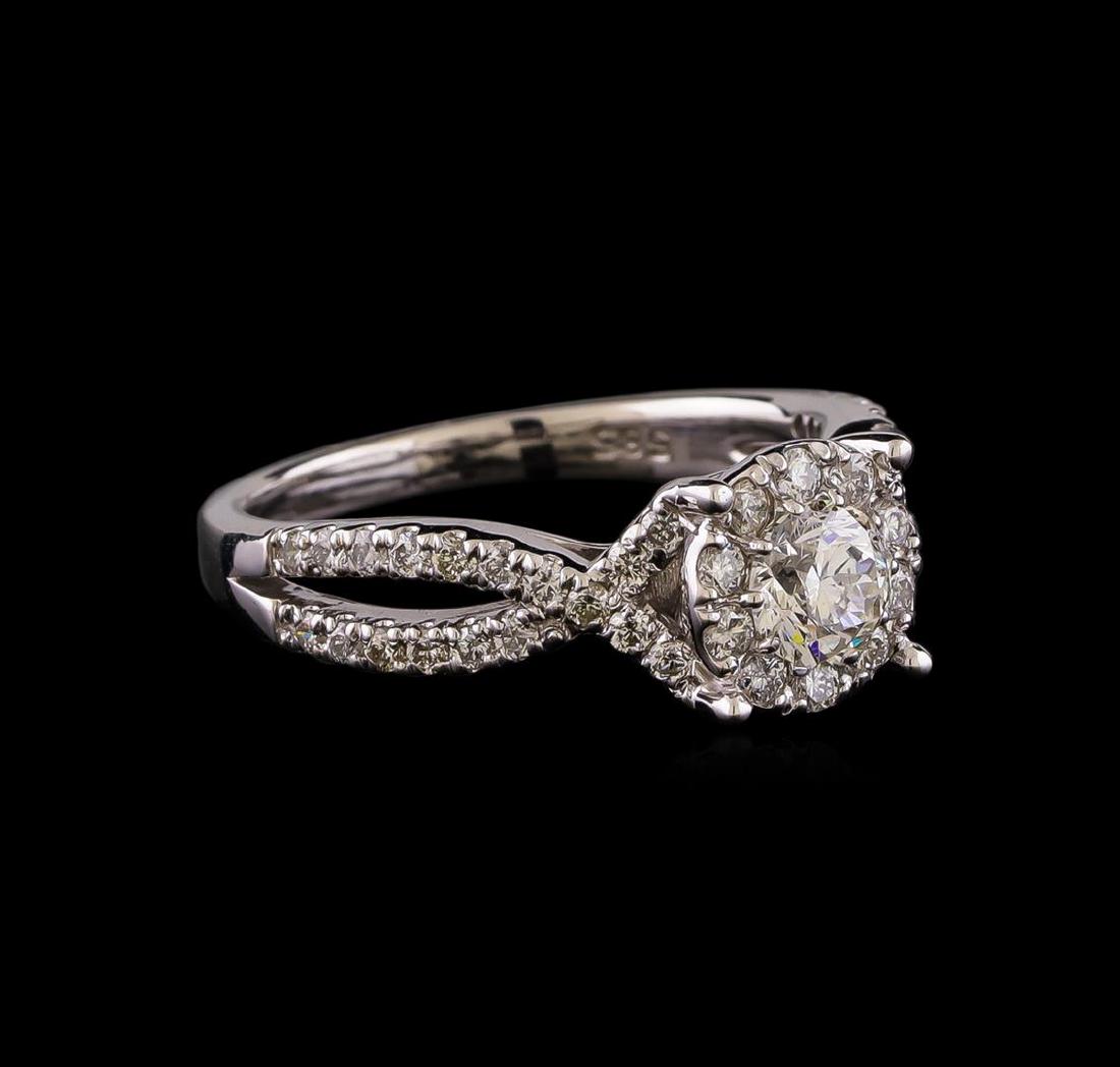 1.05 ctw Diamond Ring - 14KT White Gold: One electronically tested 14KT white gold lady's cast wedding ring with a split shank halo with a bright polish finish. The featured lady's ring has a shank measuring 2.08 millimeters wide. Identified